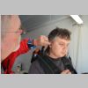 Rob securing earpiece for Dmitrii.jpg